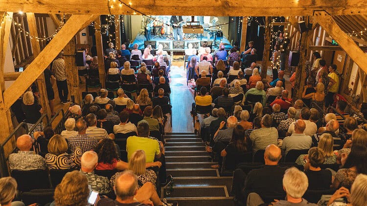 webPacked-audience-enjoying-show-at-Hanger-Farm
